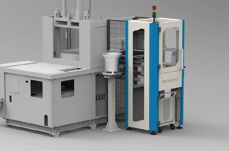 Vertical rotary table injection moulding machine with bowl feeder and enclosed robot cell