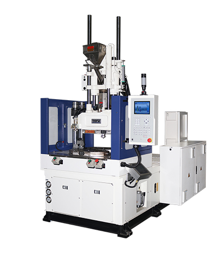 KMS vertical injection moulding machine on a production floor
