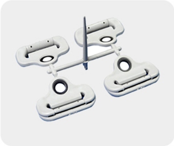 Overmoulded safety belt fastener